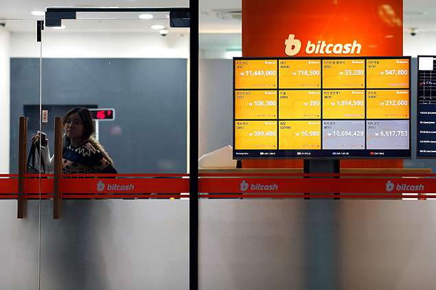 A customer leaves Bitcash, a virtual currency exchange office in Seoul, South Korea, Nov. 28, 2017. Around the world, ordinary people with no prior experience in virtual currencies have been lured into the markets by soaring prices, but nowhere has the public frenzy been more feverish than in South Korea. (Woohae Cho/The New York Times) 