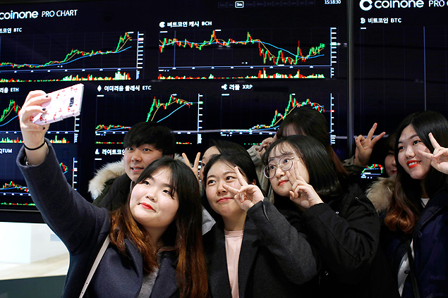 Students of Konyang University visit Coinone, a virtual currency exchange office in Seoul, South Korea, Nov. 28, 2017. Around the world, ordinary people with no prior experience in virtual currencies have been lured into the markets by soaring prices, but nowhere has the public frenzy been more feverish than in South Korea. (Woohae Cho/The New York Times) 