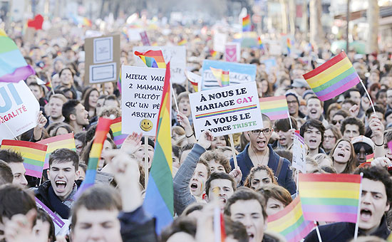 ORG XMIT: CHM10 Demonstrators march through the streets of Paris in support of the French government's draft law to legalise marriage and adoption for same-sex couples, January 27, 2013. Sign reads, "For Us Gay Marriage - For You Sad Divorce". REUTERS/Christian Hartmann (FRANCE - Tags: POLITICS RELIGION)