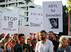 Demonstrators with posters of U.S intelligence contractor Edward Snowden protest against US National Security Agenca (NSA) surveillance program, in front of the US consulate in Hamburg, Germany.