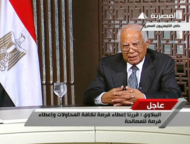 Primeiro-ministro Hazem al-Beblawi em pronunciamento na televiso aps confrontos 