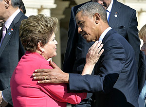 US President Barack Obama greets Brazil's President Dilma Rousseff as he arrives for the family photo at the G20 summit on September 6, 2013 in Saint Petersburg. 