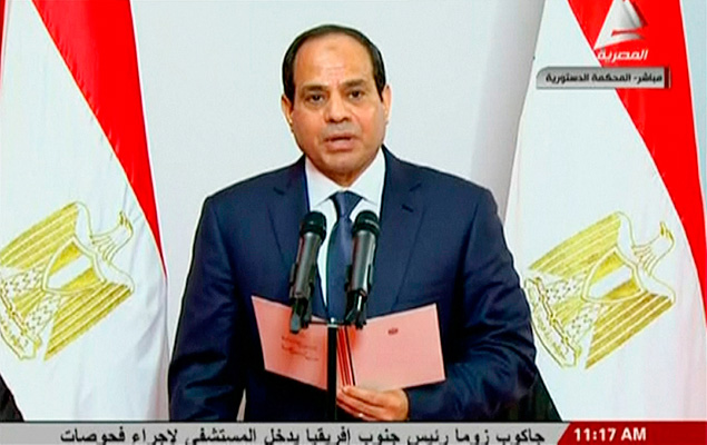 Former army chief Abdel Fattah al-Sisi takes the oath of office during his swearing-in ceremony as Egypt's new president at the Supreme Constitutional Court in Cairo, June 8, 2014 in this still image taken from video. Al-Sisi was sworn in as president of Egypt on Sunday in a ceremony with low-key attendance by Western allies concerned by the country's crackdown on dissent since he ousted Islamist leader Mohamed Mursi last year. REUTERS/Egyptian State Television via Reuters TV (EGYPT - Tags: POLITICS) ATTENTION EDITORS - THIS IMAGE WAS PROVIDED BY A THIRD PARTY. FOR EDITORIAL USE ONLY. NOT FOR SALE FOR MARKETING OR ADVERTISING CAMPAIGNS. NO SALES. NO ARCHIVES. THIS PICTURE IS DISTRIBUTED EXACTLY AS RECEIVED BY REUTERS, AS A SERVICE TO CLIENTS. EGYPT OUT. NO COMMERCIAL OR EDITORIAL SALES IN EGYPT ORG XMIT: SIN202