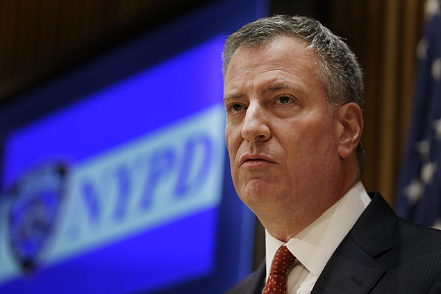 New York City Mayor Bill de Blasio listens during a news conference at police headquarters in New York, Monday, Dec. 22, 2014. De Blasio called Monday for a pause in protests over police conduct as he faced a widening rift with those in a grieving force who accuse him of creating a climate of mistrust that contributed to the execution of two officers. (AP Photo/Seth Wenig) ORG XMIT: NYSW119