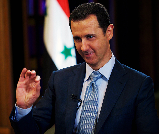A handout picture dated February 8, 2015, and released by the Syrian Arab News Agency (SANA) on February 10, 2015 shows Syrian President Bashar al-Assad (R) giving an interview to the BBC's Middle East Editor in Damascus. Assad said in an interview published on Tuesday, that Damascus receives "information" about air strikes by the US-led coalition against the Islamic State group in Syria. AFP PHOTO/HO/SANA == RESTRICTED TO EDITORIAL USE - MANDATORY CREDIT "AFP PHOTO / HO / SANA" - NO MARKETING NO ADVERTISING CAMPAIGNS - DISTRIBUTED AS A SERVICE TO CLIENTS == ORG XMIT: SAN15