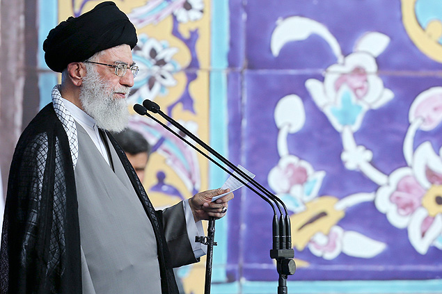 In this picture released by an official website of the office of the Iranian supreme leader on Saturday, July 18, 2015, Supreme Leader Ayatollah Ali Khamenei delivers his sermon during the Eid al-Fitr prayer at the Imam Khomeini Grand Mosque in Tehran, Iran. Khamenei said a historic nuclear deal with world powers reached this week won't change Iran's policy towards the 