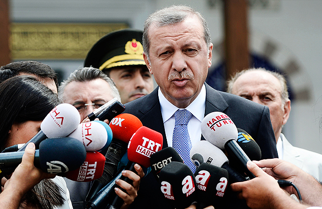 Turkish President Recep Tayyip Erdogan speaks to the media in front of a mosque in Istanbul, Turkey, Friday, July 24, 2015. In a major tactical shift, Turkish warplanes struck Islamic State group targets Friday across the border in Syria, Turkish officials announced _ a move that came a day after IS militants fired at a Turkish military outpost, killing a soldier. In a related, long-awaited development, Erdogan confirmed that Turkey had agreed to let the U.S. use a key base in southern Turkey for military operations against the militants "within a certain framework."(AP Photo/Depo Photos) ORG XMIT: ANK106