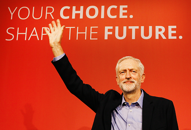 Jeremy Corbyn waves on stage after new is announced as the new leader of The Labour Party during the Labour Party Leadership Conference in London, Saturday, Sept. 12, 2015. Corbyn will now lead Britain's main opposition party. (AP Photo/Kirsty Wigglesworth) ORG XMIT: LKW101