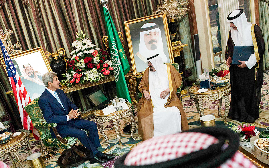 Saudi Ambassador to the United States, Adel al-Jubeir (R) listens while Saudi King Abdullah bin Abdul Aziz al-Saud (C) and US Secretary of State John Kerry talk before a meeting at the Royal Palace in Jeddah September 11, 2014. The United States signed up Arab allies on Thursday to a 