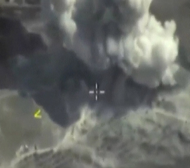 A frame grab taken from footage released by Russia's Defence Ministry October 3, 2015, shows smoke rising after airstrikes carried out by Russian air force on what Russia says was an underground explosives warehouse in Raqqa, Syria. Russia's Air Force has made over 20 flights in Syria in the past 24 hours and targeted nine Islamic State objects, Russian news agencies cited a Defence Ministry official as saying on Saturday. REUTERS/Ministry of Defence of the Russian Federation/Handout via Reuters ATTENTION EDITORS - THIS IMAGE WAS PROVIDED BY A THIRD PARTY. REUTERS IS UNABLE TO INDEPENDENTLY VERIFY THE AUTHENTICITY, CONTENT, LOCATION OR DATE OF THIS IMAGE. IT IS DISTRIBUTED EXACTLY AS RECEIVED BY REUTERS, AS A SERVICE TO CLIENTS. FOR EDITORIAL USE ONLY. NOT FOR SALE FOR MARKETING OR ADVERTISING CAMPAIGNS. NO SALES. ORG XMIT: MOS03