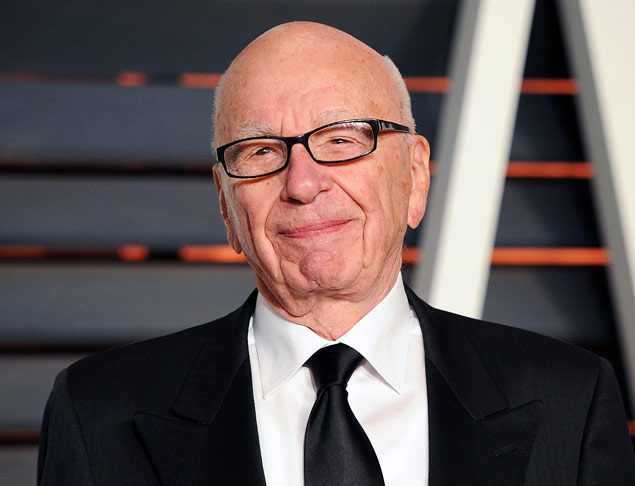FILE - In this Feb. 22, 2015 file photo, Rupert Murdoch arrives at the 2015 Vanity Fair Oscar Party in Beverly Hills, Calif. Murdoch, issued an apology Thursday, Oct. 8, after he faced social media backlash following his suggestion that President Barack Obama isn't a "real black president." (Photo by Evan Agostini/Invision/AP, FIle) ORG XMIT: NYET403