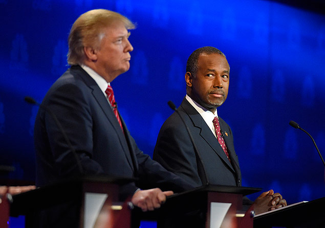 Ben Carson, right, watches Donald Trump during the CNBC Republican presidential debate at the University of Colorado, Wednesday, Oct. 28, 2015, in Boulder, Colo. (AP Photo/Mark J. Terrill) ORG XMIT: COTS150