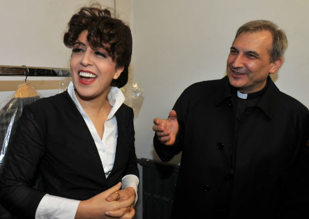In this photo taken on January 15, 2014 at the Parioli theatre Monsignor Lucio Angel Vallejo Balda (R) stands next to social media expert Francesca Chaouqui. The Vatican has arrested Vallejo and Chaouqui for allegedly stealing and leaking classified documents in the second such scandal to hit the secretive institution in three years. Monsignor Lucio Angel Vallejo Balda, 54, who served on a special commission set up by Pope Francis to advise him on economic reform within the Vatican, was arrested along with a second member of the commission, Francesca Chaouqui. The arrests were part of a several months-long investigation into the 