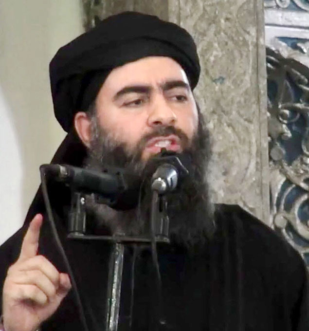 FILE - This file image made from video posted on a militant website Saturday, July 5, 2014, which has been authenticated based on its contents and other AP reporting, purports to show the leader of the Islamic State group, Abu Bakr al-Baghdadi, delivering a sermon at a mosque in Iraq. Lebanese authorities have detained a wife and son of the leader of the Islamic State group and she is being questioned, two senior Lebanese officials said Tuesday, Dec. 2, 2014. (AP Photo/Militant video, File) ORG XMIT: CAIMA101