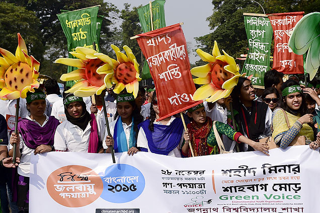 Bengaleses participam de marcha pelo climas em Dhaka; conferência sobre o clima tem inicio nesta segunda (30)