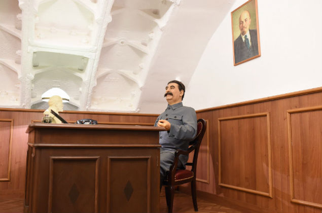 MOSCOW, Dec. 15, 2015 (Xinhua) -- Photo taken on Dec. 15, 2015 shows a model of Joseph Stalin sitting in the cabinet inside the counter-nuclear underground museum, shelter "Bunker-42", in Moscow, Russia. A real underground counter-nuclear shelter for a high Soviet military command was remade into a museum of the Cold War. The underground counter-nuclear shelter was designed with the capability to provide a month of independent and isolated life for the refugees, with a full control over USSR' army forces, including nuclear weapon. (Xinhua/Evgeny Sinitsyn)