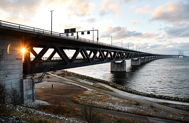 The sun sets over the Oresund Bridge between Sweden and Denmark, seen from Lernacken, Sweden, on Sunday Jan. 3, 2016 On upcoming Monday Jan. 4, 2016, new travel restrictions are set to be imposed by Sweden to stem a record flow of migrants, transforming the Oresund bridge between Sweden and Denmark into a striking example of how national boundaries are re-emerging in Europe. (Erland Vinberg /TT via AP, File) SWEDEN OUT ORG XMIT: LON817