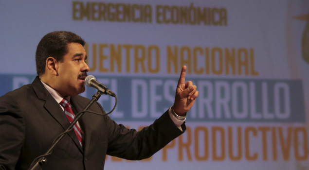 Venezuela's President Nicolas Maduro speaks during a meeting with entrepreneurs and representatives of the productivity sector in Caracas, in this handout picture provided by Miraflores Palace on January 19, 2016. The words in the back read, 