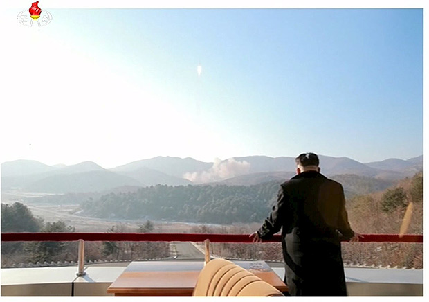 North Korean leader Kim Jong Un watches a long range rocket launched into the air in this still image taken from KRT file footage and released by Yonhap on February 7, 2016. The satellite launched into orbit by North Korea on Saturday has now stabilized in its orbit around the earth, a U.S. official and a second source familiar with the matter said on February 9, 2016. REUTERS/Yonhap/Files ATTENTION EDITORS - THIS PICTURE WAS PROVIDED BY A THIRD PARTY. REUTERS IS UNABLE TO INDEPENDENTLY VERIFY THE AUTHENTICITY, CONTENT, LOCATION OR DATE OF THIS IMAGE. THIS PICTURE IS DISTRIBUTED EXACTLY AS RECEIVED BY REUTERS, AS A SERVICE TO CLIENTS. FOR EDITORIAL USE ONLY. NOT FOR SALE FOR MARKETING OR ADVERTISING CAMPAIGNS. FOR EDITORIAL USE ONLY. NO RESALES. NO ARCHIVE. SOUTH KOREA OUT. NO COMMERCIAL OR EDITORIAL SALES IN SOUTH KOREA. ORG XMIT: RPA201