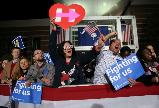 FEBRUARY 26: Supporters of Democratic Presidential candidate, former Secretary of State Hillary Clinton cheer as she is introduced during a "Get Out the VoteÓ rally February 26, 2016 in Columbia, South Carolina. Clinton continues her campaign in South Carolina, as the state holds its Democratic primary tomorrow. Win McNamee/Getty Images/AFP == FOR NEWSPAPERS, INTERNET, TELCOS & TELEVISION USE ONLY ==