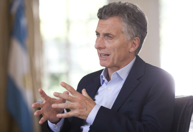  President Mauricio Macri speaks during an interview with The Associated Press at the Olivos' presidential residency in Buenos Aires, Argentina, Wednesday, March 16, 2016. Macri says he is outraged by corruption that seeped into all facets of society during his predecessor's administration and believes that the upcoming visit of U.S. President Barack Obama will lead to billions in investment. (AP Photo/Victor R. Caivano) ORG XMIT: VC104