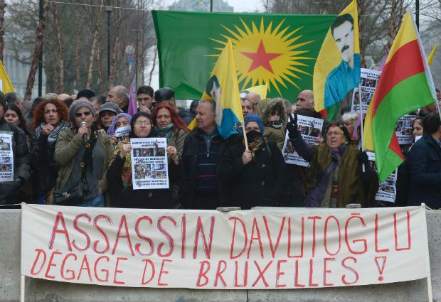 Kurdish people take part in a protest to call for an end of the Turkish State terror in Kurdistan, during the European Union summit in Brussels on March 18, 2016. Underscoring tension with Brussels, Turkish President Recep Tayyip Erdogan accused the Europeans of supporting the outlawed Kurdistan Workers' Party (PKK) days after a bombing in Ankara claimed by Kurdish rebels that killed 35 people. Many European Union states have expressed concerns about Ankara's human rights record, including its treatment of the Kurds and a crackdown on critics of the government. The United Nations and rights groups fear the deal could violate international law that forbids the mass deportation of refugees. / AFP PHOTO / JOHN THYS ORG XMIT: THY01