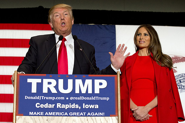 FILE - In this Feb. 1, 2016 file photo, Republican presidential candidate Donald Trump, accompanied by his wife Melania Trump, speaks during a campaign event in Cedar Rapids, Iowa. Ted Cruz accused Trump of stoking false rumors about his personal life on Friday, March 25, 2016, charging that the billionaire businessman and GOP front-runner is trafficking in "sleaze" and "slime." (AP Photo/Mary Altaffer, File) ORG XMIT: WX103