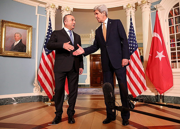 WASHINGTON, DC - MARCH 28: U.S. Secretary of State John Kerry (R) and Turkish Foreign Minister Mevlut Cavusoglu (L) shake hands after delivering brief remarks before meeting at the State Department on March 28, 2016 in Washington, DC. Kerry and Cavusoglu met to discuss a range of issues including a possible Cyprus deal. Win McNamee/Getty Images/AFP == FOR NEWSPAPERS, INTERNET, TELCOS & TELEVISION USE ONLY ==