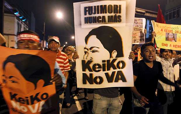 Protesters march against Peruvian presidential candidate Keiko Fujimori in downtown Lima, Peru, April 5, 2016. The sign reads 