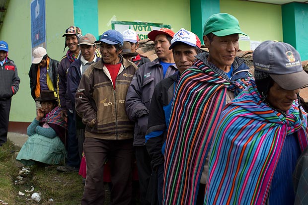 Quechua indigenous men stand in line to vote during general elections in Uchuraccay, Peru, Sunday, April 10, 2016. With the daughter of Peru's jailed former strongman the runaway favorite to get the most votes in Sunday's presidential election, all eyes are on the race for second place and the right to face Keiko Fujimori in an expected presidential runoff. Also up for grabs on Sunday are all the seats in Peru's congress. (AP Photo/Rodrigo Abd) ORG XMIT: ABD113