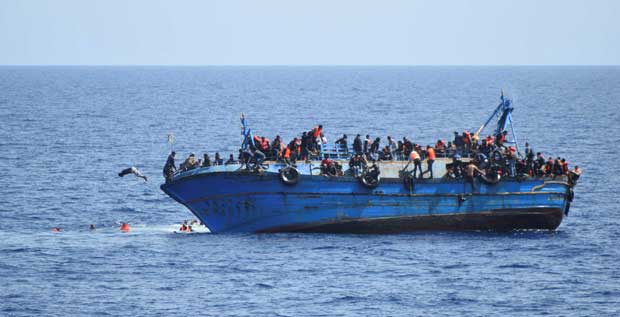 Migrants are seen on a capsizing boat before a rescue operation by Italian navy ships "Bettica" and "Bergamini" (unseen) off the coast of Libya in this handout picture released by the Italian Marina Militare on May 25, 2016. Marina Militare/Handout via REUTERS ATTENTION EDITORS - THIS PICTURE WAS PROVIDED BY A THIRD PARTY. FOR EDITORIAL USE ONLY. TPX IMAGES OF THE DAY ORG XMIT: MXR05