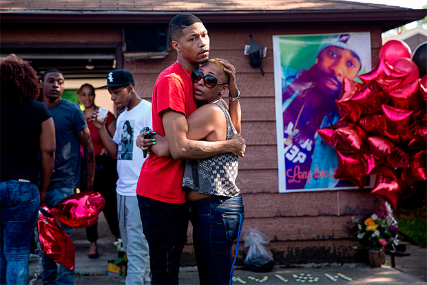 A backyard memorial for Mark Lindsey, 25, shot dead sitting in his car outside his mothers house on Friday. Whitney Curtis for The New York Times 
