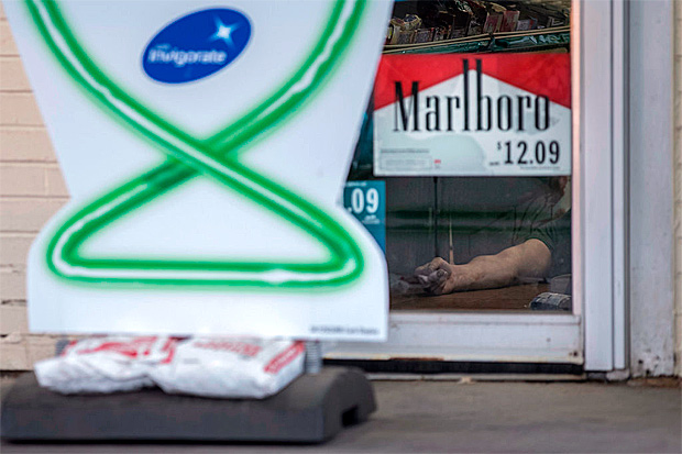  The body of Damien Cionzynski, 25, who was killed inside a BP gas station on Saturday. Whitney Curtis for The New York Times 
