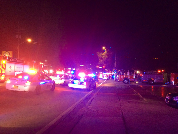 This handout photo provided by the Orlando Police Department on June 12, 2016 shows police cars outside of the Pulse Night Club in Orlando following an "active shooting" and described as a "mass casuality situation," according to Orlando police. Several people were injured at a nightclub in downtown Orlando, Florida, early June 12, with police in the southern US state describing the situation as an "active shooting" and described as a "mass casuality situation," according to Orlando police.