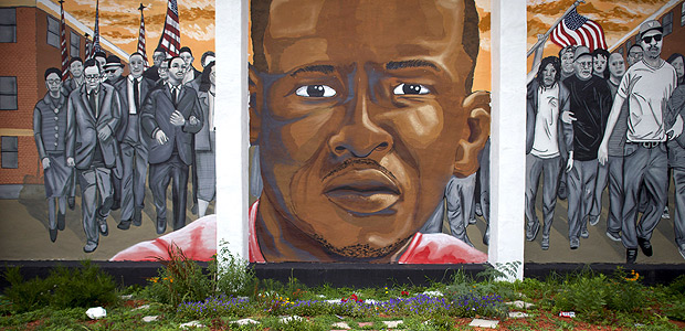 BALTIMORE, MD - JUNE 23: Trash collects below a mural of Freddie Gray after Baltimore police officer Caesar Goodson Jr. was found not guilty on all charges on June 23, 2016 in Baltimore, Maryland. Officer Goodson, the van driver in the Freddie Gray case, is facing multiple charges including second-degree murder. This is the third trial related to the death of Freddie Gray, who died while in police custody. Mark Makela/Getty Images/AFP == FOR NEWSPAPERS, INTERNET, TELCOS & TELEVISION USE ONLY ==
