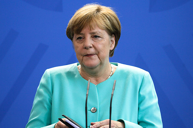 German Chancellor Angela Merkel speaks during a statement about the referendum in Britain at the chancellery in Berlin, Friday, June 24, 2016. Britain voted to leave the European Union after a bitterly divisive referendum campaign, according to tallies of official results Friday. (AP Photo/Markus Schreiber7 ORG XMIT: MSC108