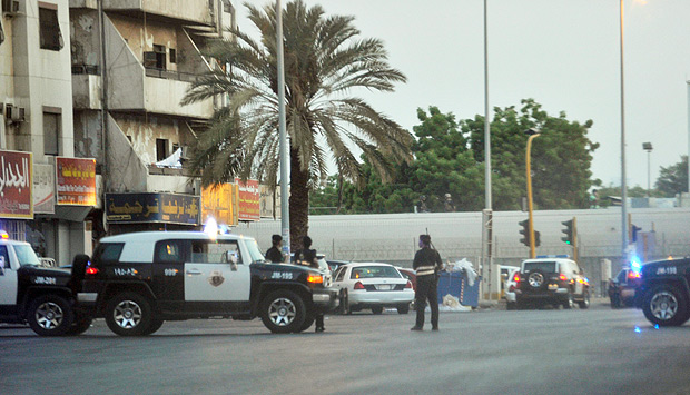 Saudi policemen stand guard at the site where a suicide bomber blew himself up in the early hours of July 4, 2016 near the American consulate in the Red Sea city of Jeddah. Security officers became suspicious of a man near the parking lot of Dr Suleiman Faqeeh Hospital, which is directly across from the US diplomatic mission. When they moved in to investigate "he blew himself up with a suicide belt inside the hospital parking" at around 2:15 am, the ministry said, adding that two security officers were lightly injured. / AFP PHOTO / STRINGER