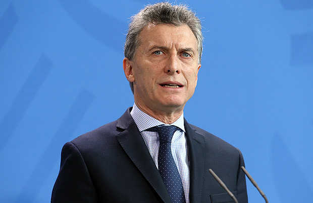 Argentina's President Mauricio Macri speaks during a joint news conference with German Chancellor Angela Merkel at the chancellery in Berlin, Germany, Tuesday, July 5, 2016. (Wolfgang Kumm/dpa via AP) ORG XMIT: LGL120