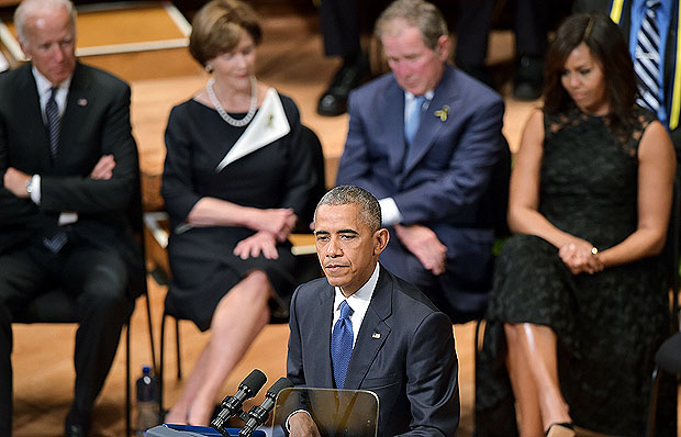 US President Barack Obama speaks during an interfaith memorial service for the victims of the Dallas police shooting at the Morton H. Meyerson Symphony Center on July 12, 2016 in Dallas, Texas. President Barack Obama attended a somber memorial Tuesday to five police officers slain in a sniper ambush in Dallas, as he seeks to unify a country divided by race and politics. / AFP PHOTO / Mandel NGAN ORG XMIT: MNN028