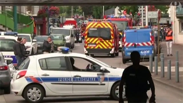 Priest killed after hostages taken in Normandy church, French police say. Two men armed with knives shot dead by police after taking five hostages in Saint-tienne-du-Rouvray and reportedly slitting priest's throat