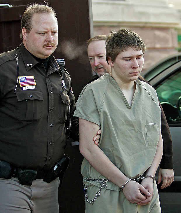 FILE - In this Friday, March 3, 2006 photo, Brendan Dassey, 16, is escorted out of a Manitowoc County Circuit courtroom in Manitowoc, Wis. A federal court in Wisconsin on Friday overturned the conviction of Dassey, a man found guilty of helping his uncle kill Teresa Halbach in a case profiled in the Netflix documentary "Making a Murderer." (AP Photo/Morry Gash, File) ORG XMIT: NY120