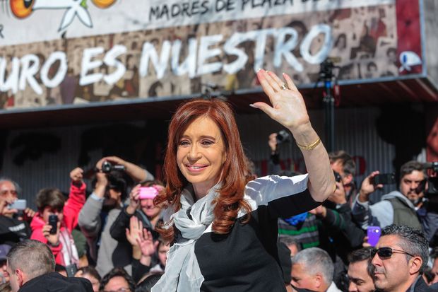 Photo released by Telam of former Argentinian President Cristina Fernandez de Kirchner waving upon her arrival at the Madres de Plaza de Mayo Human Rights organization's headquarters in Buenos Aires on August 11, 2016. Kirchner will meet the organization's head Hebe de Bonafini ahead of the group's 2000th round in the square, where they have met every Thursday since 1977 to protest for their children missing during the last military dictatorship (1976-1983) in Argentina. / AFP PHOTO / TELAM / STR / RESTRICTED TO EDITORIAL USE - MANDATORY CREDIT "AFP PHOTO / TELAM" - NO MARKETING NO ADVERTISING CAMPAIGNS - DISTRIBUTED AS A SERVICE TO CLIENTS