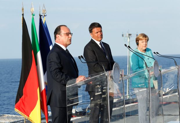 Italian Prime Minister Matteo Renzi, German Chancellor Angela Merkel (R) and French President Francois Hollande (L) lead a news conference on the Italian aircraft carrier Garibaldi off the coast of Ventotene island, central Italy, August 22, 2016. REUTERS/Remo Casilli ORG XMIT: MXR24
