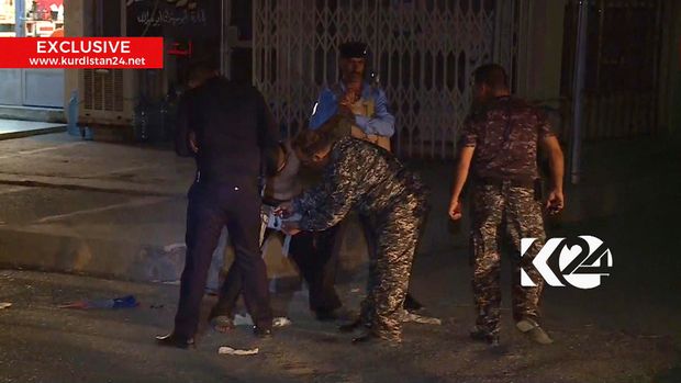 In this still taken from local TV footage, showing a child being restrained by security forces, holding his arms out-stretched as another man cuts off a belt of explosives, Sunday night Aug. 21, 2016, in Kirkuk, Iraq, Iraqi police say they have apprehended a boy would-be suicide bomber in the city of Kirkuk before he was able to detonate his explosive belt. (Kurdistan 24 TV news via AP) MANDATORY CREDIT ORG XMIT: LON802