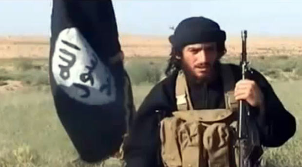 (FILES) This file image shows an image grab taken on October 2, 2013 from a video uploaded on YouTube on July 8, 2012, of the spokesman for the Islamic State of Iraq and the Levant (ISIS), Abu Mohammad al-Adnani al-Shami, speaking next to an Islamist flag at an undisclosed location. The Islamic State (IS) group announced on August 30, 2016 spokesman Adnani was killed in Syria's northern city of Aleppo. / AFP PHOTO / YOUTUBE / HO ORG XMIT: YTU02