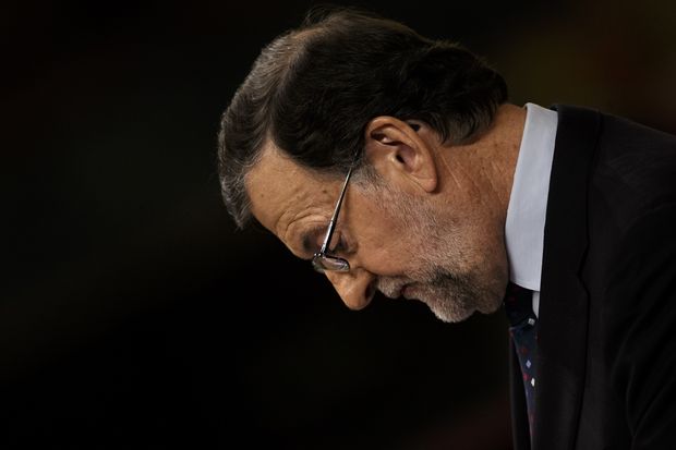 Spain's acting Prime Minister and Popular party leader Mariano Rajoy looks down as he addresses lawmakers during the second of the two investiture debates, at the Spanish parliament in Madrid, in Madrid, Spain, Friday, Sept. 2, 2016. Lawmakers in Spain's Parliament rejected for the second time in three days acting Prime Minister Mariano Rajoy's bid to form a minority government, pushing the country to a third election in a year. (AP Photo/Daniel Ochoa de Olza) ORG XMIT: DO102