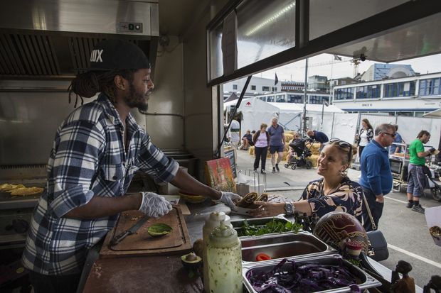 Sylvester Bbaale, who came to Denmark from Uganda as a baby in 1989, operates a food truck in Copenhagen, Denmark, Aug. 7, 2016. The thousands of Muslim asylum seekers pouring into Denmark have spawned a backlash, and questions over whether the country has a latent racial hostility at its core. Bbaale said he was beaten on the street last year by three men who told him to go back to Africa. (Ilvy Njiokiktjien/The New York Times)