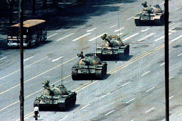 A Beijing citizen stands in front of tanks on the Avenue of Eternal Peace in this June 5, 1989 file photo during the crushing of the Tiananmen Square uprising. June 4 marks the 25th anniversary of the suppression of pro-democracy protests in Tiananmen Square in 1989. Picture taken June 5, 1989. REUTERS/Stringer/Files (CHINA - Tags: POLITICS CIVIL UNREST ANNIVERSARY) ORG XMIT: PEK09
