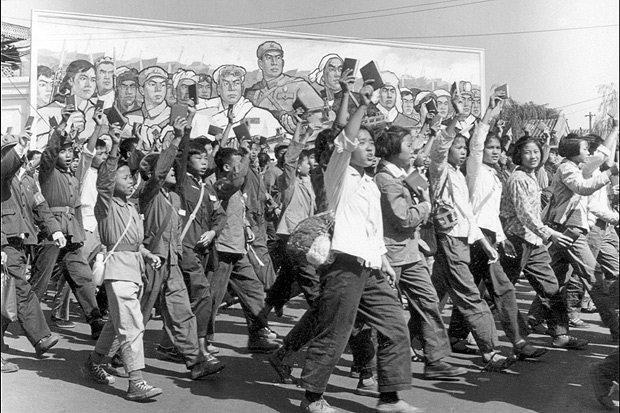 (FILES) This file photo taken in June 1966 shows Red Guards, high school and university students, waving copies of Chairman Mao Zedong's 