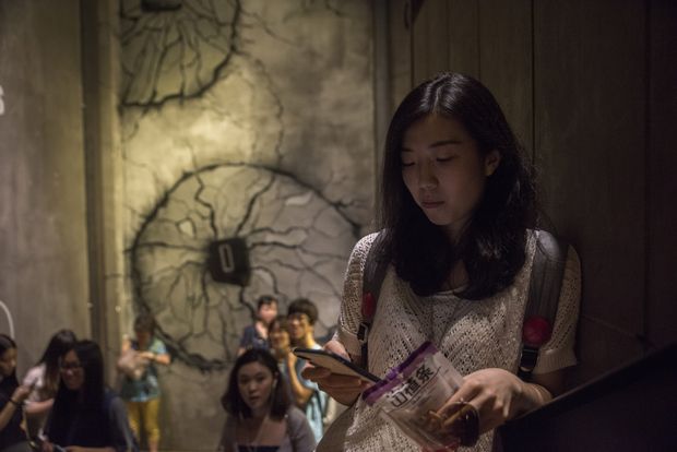 Wu Jingjing, 29, at a theater in Beijing, Aug. 2, 2016. Wu, who is single and works at an internet company, said young people in China no longer just want someone to marry, they want a relationship based on love. The decline in marriages in China means a decline in the number of babies, and potentially less spending, which China needs to drive economic growth. (Gilles Sabrie/The New York Times) - XNYT158